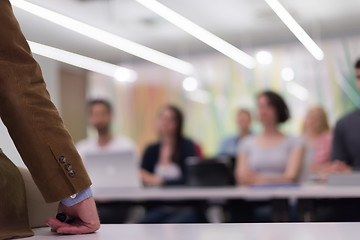 Image showing close up of teacher hand while teaching in classroom