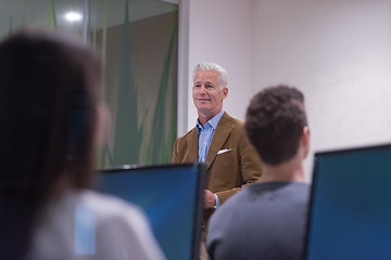 Image showing teacher and students in computer lab classroom