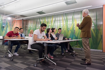 Image showing teacher with a group of students in classroom