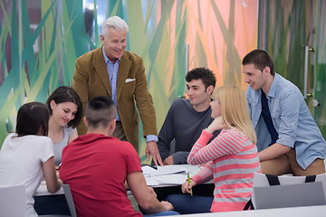 Image showing teacher with a group of students in classroom