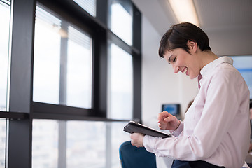 Image showing business woman on meeting  using tablet