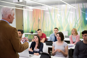 Image showing teacher with a group of students in classroom