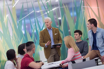 Image showing teacher with a group of students in classroom