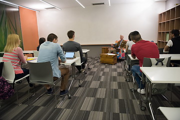 Image showing teacher with a group of students in classroom