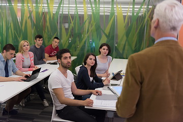 Image showing teacher with a group of students in classroom