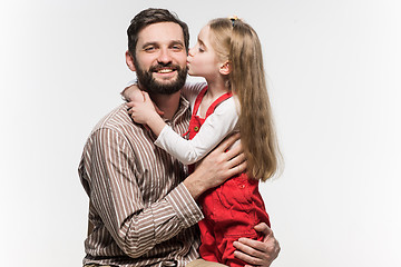 Image showing Girl hugging her father  over a white background