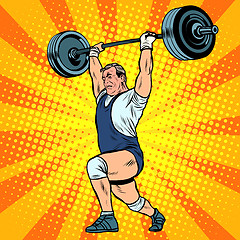 Image showing Weightlifting a weightlifter raises the bar