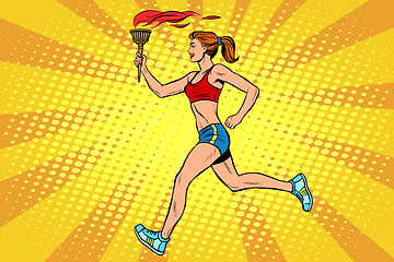 Image showing The girl athlete torchbearer sports fire summer games