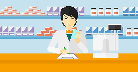 Image showing Pharmacist taking notes.