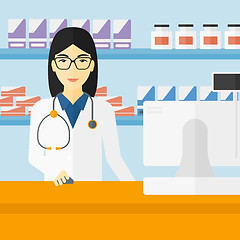 Image showing Pharmacist at counter with computer monitor.