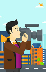 Image showing Cameraman with video camera.