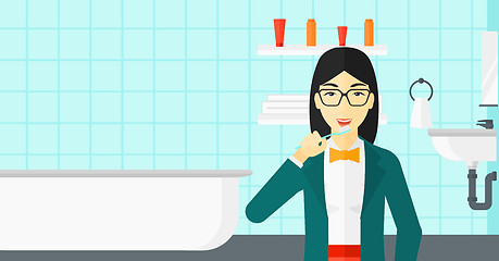 Image showing Woman brushing teeth.