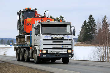 Image showing Scania 143M Truck Hauls Excavator