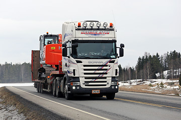 Image showing White Scania Truck Hauls Hitachi Zaxis Medium Excavator 