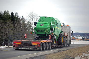 Image showing John Deere W330 Compact Combine on Lowboy Trailer