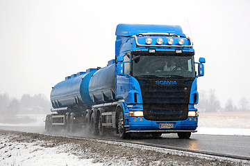 Image showing Blue Scania Tank Truck Trucking in Snowfall