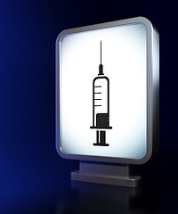 Image showing Healthcare concept: Syringe on billboard background