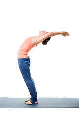 Image showing Sporty fit woman practices yoga asana Anuvittasana