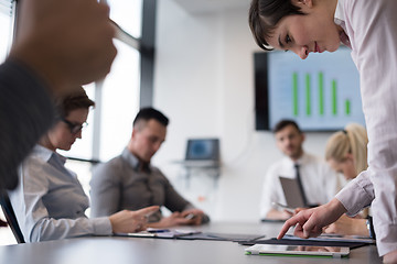 Image showing young  woman using  tablet on business meeting