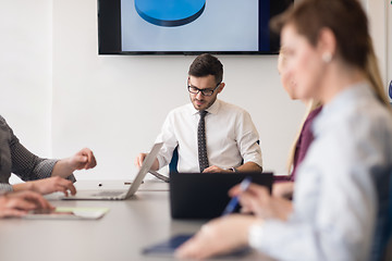 Image showing young business people group on team meeting at modern office