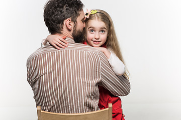 Image showing Girl hugging her father  over a white background