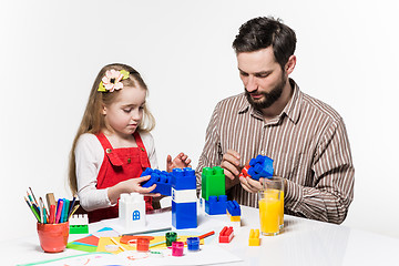 Image showing Father and daughter playing educational games together 