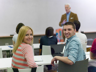 Image showing teacher with a group of students in classroom