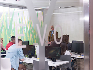 Image showing senior teacher and students group in computer lab classroom