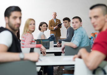 Image showing teacher with a group of students in classroom