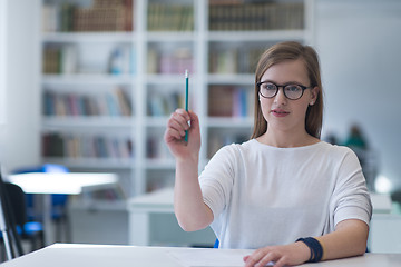 Image showing female student study in school library