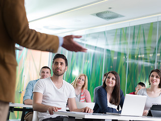 Image showing close up of teacher hand while teaching in classroom