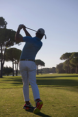 Image showing golf player hitting shot