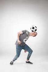 Image showing The guy with ball on gray background