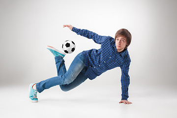 Image showing The portrait of fan with ball on gray background