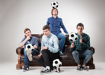 Image showing The four guys with balls on gray background