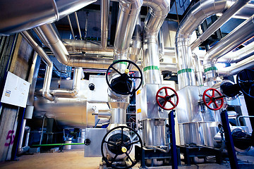 Image showing Equipment, cables and piping as found inside of a modern industr