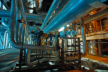 Image showing Equipment, cables and piping as found inside of a modern industr