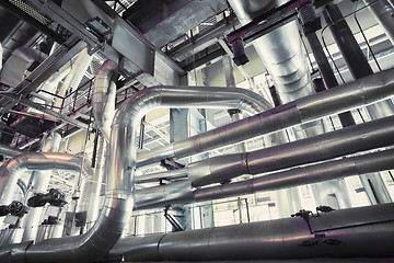 Image showing different size and shaped pipes and valves at a power plant 