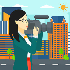 Image showing Camerawoman with video camera.