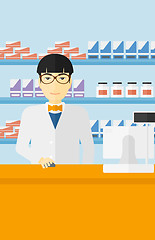 Image showing Pharmacist at counter with computer monitor.