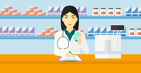 Image showing Pharmacist taking notes.