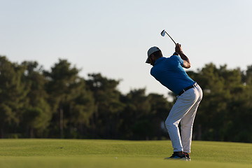 Image showing golfer hitting long shot