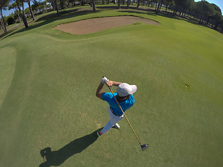 Image showing top view of golf player hitting shot