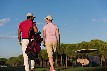 Image showing couple walking on golf course