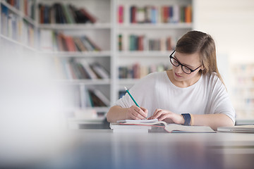 Image showing female student study in school library