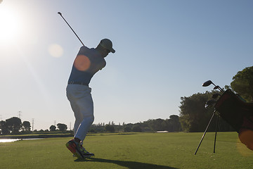 Image showing golf player hitting shot