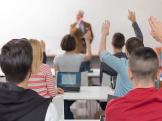 Image showing students group raise hands up on class