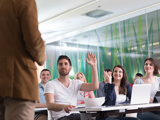 Image showing close up of teacher hand while teaching in classroom