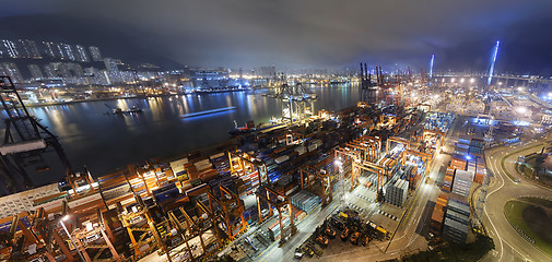 Image showing Cargo ship and crane at port reflect on sea bay,