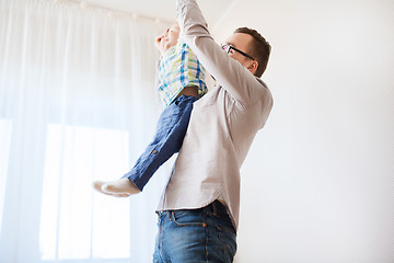 Image showing father with son playing and having fun at home